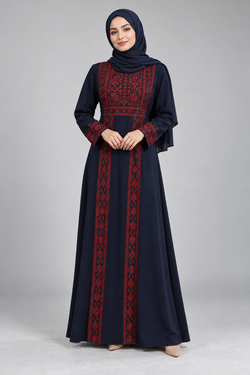 Dress with red embroidery-inspired details — illustrative CJC Heritage collection